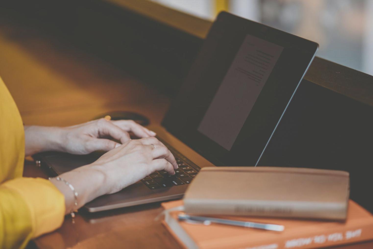 Students collaborating on finance projects in modern classroom setting